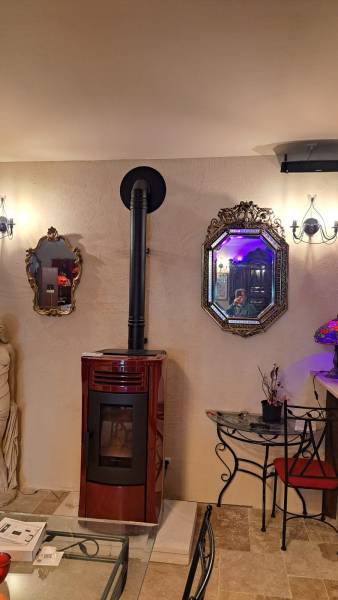 Service de pose de poêle à granulés Nordica en Ile de France.